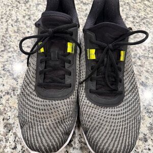 Puma Black and Gray Athletic Shoes with Yellow Accents
